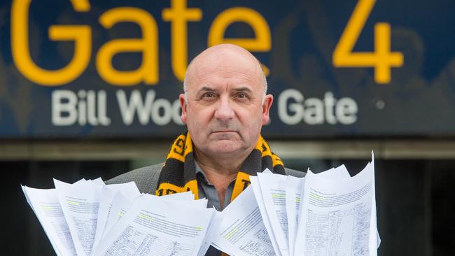 Joe Garra with a petition of almost 900 names asking the Tigers not to strip seats from members. Picture: Jason Edwards