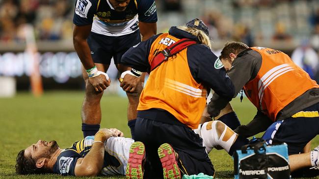 Sam Carter of the Brumbies is injured against the Bulls.