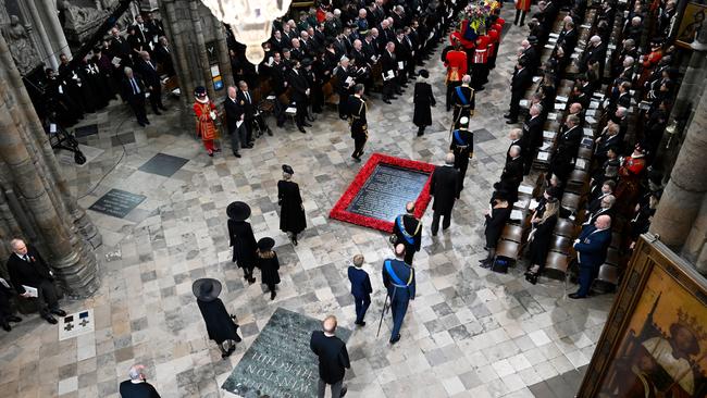 Members of the Royal Family arrive at Westminster Abbey as the coffin of Queen Elizabeth II with the Imperial State Crown resting on top is carried by the Bearer Party. Picture: Getty Images