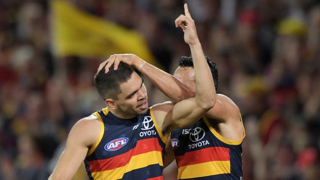 Charlie Cameron celebrates one of his five goals with Crows teammate Eddie Betts. Picture: AAP Image/Tracey Nearmy