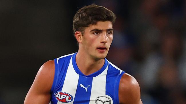 MELBOURNE, AUSTRALIA - APRIL 05: Harry Sheezel of the Kangaroos takes possession of the ball during the round four AFL match between North Melbourne Kangaroos and Sydney Swans at Marvel Stadium, on April 05, 2025, in Melbourne, Australia. (Photo by Morgan Hancock/Getty Images)
