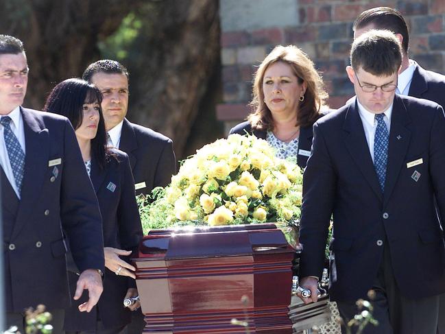 Lewis Moran’s casket is wheeled out of St Therese’s church in Essendon on April 6, 2004. Picture: Brett Hartwig