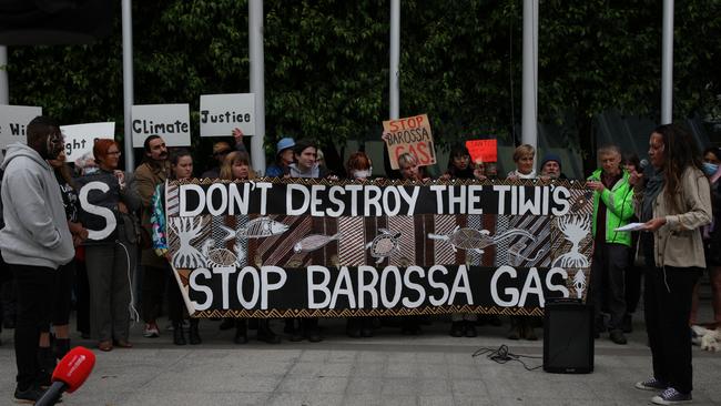 Protesters hold a banner at the front of the Federal Court of Australia, which was hearing an appeal by Santos over its Barossa gas project, in November 2022. Picture: Getty Images