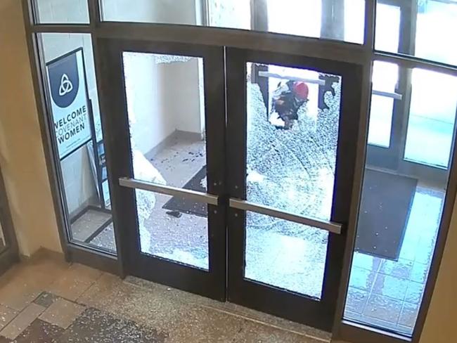 Hale shot through the locked doors to gain entry to the school. Picture: Twitter/Metro Nashville PD