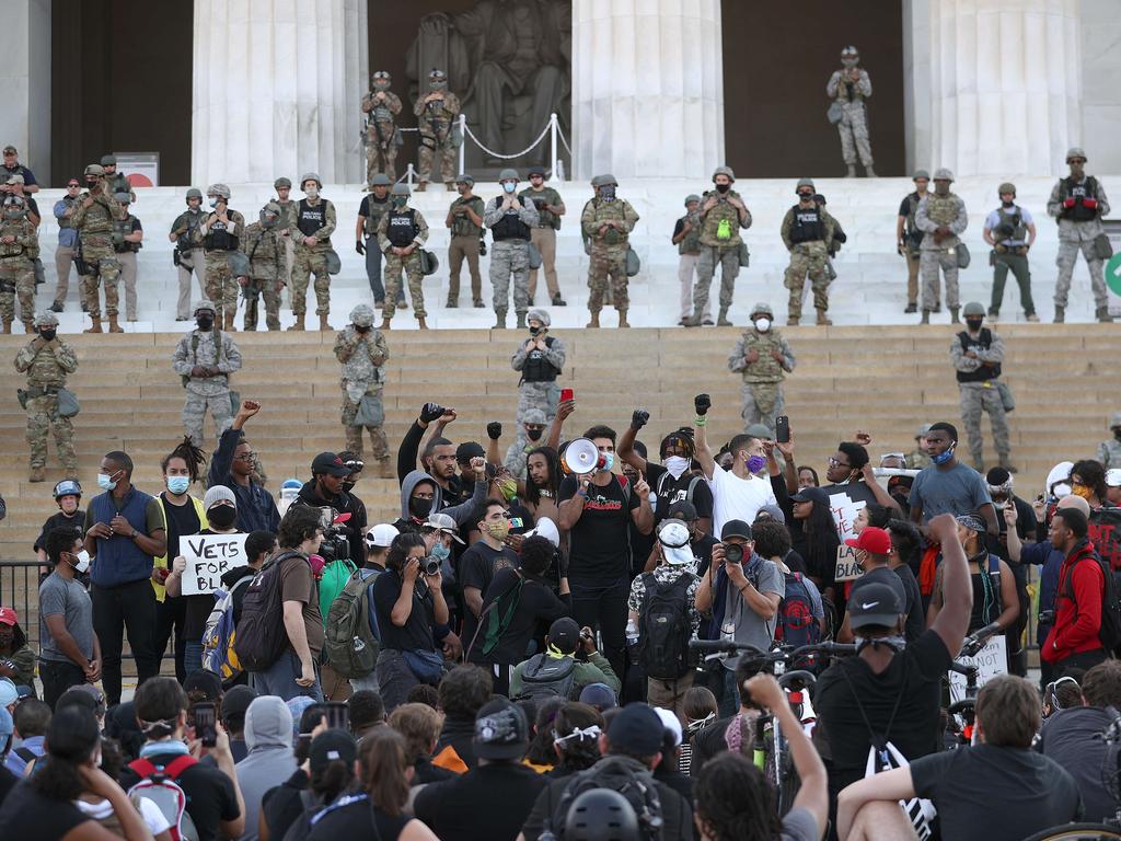 Protesters ignore city curfews