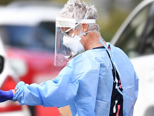 BRISBANE, AUSTRALIA - NewsWire Photos - SEPTEMBER 30, 2021.A health worker processes members of the public at a drive through Covid-19 testing clinic at Murarrie in Brisbane. Picture: NCA NewsWire / Dan Peled