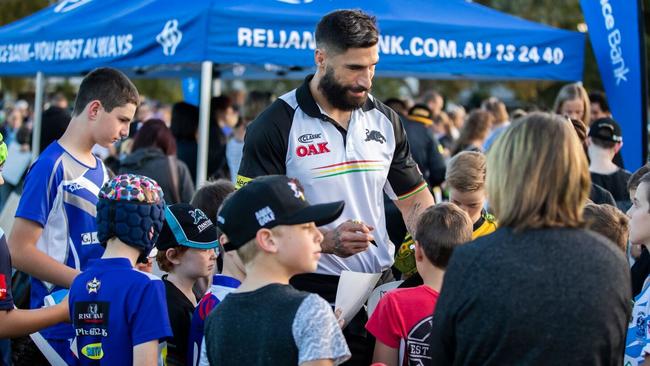 Penrith’s James Tamou meets locals at a coaching clinic in Bathurst.