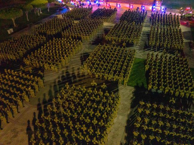 Handout picture released by El Salvador's Presidency Press Office showing an aerial view of soldiers standing guard before taking part in an operation to arrest gang members in San Marcos, El Salvador, in the early hours of October 28, 2024. Around 2,500 soldiers and police surrounded a shantytown on the outskirts of San Salvador to arrest gang members, the country's president, Nayib Bukele, announced on Monday. (Photo by Handout / EL SALVADOR'S PRESIDENCY PRESS OFFICE / AFP) / RESTRICTED TO EDITORIAL USE - MANDATORY CREDIT "AFP PHOTO / EL SALVADOR'S PRESIDENCY PRESS OFFICE" - NO MARKETING - NO ADVERTISING CAMPAIGNS - DISTRIBUTED AS A SERVICE TO CLIENTS