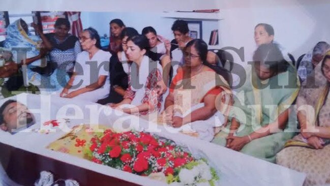 Mr Abraham’s relatives with his wife Sofia Sam at his funeral in India.