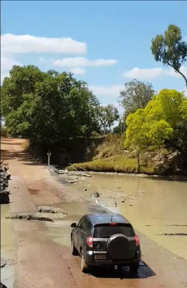 The car was forced to wait until the slow-moving crocodiles cleared the path. Picture: Kimberley Off-Road Adventure Tours