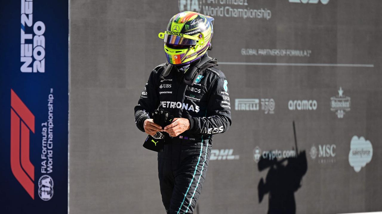 Mercedes' British driver Lewis Hamilton leaves after the qualifying session ahead of the Italian Formula One Grand Prix at the Autodromo Nazionale circuit in Monza on September 10, 2022. (Photo by ANDREJ ISAKOVIC / AFP)