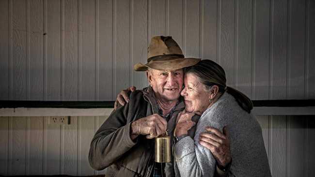 RINGING OUT: Ross McLeod and partner Sheila Moore have a cuddle as they pack up Ross's  bell collection . Picture: Adam Hourigan