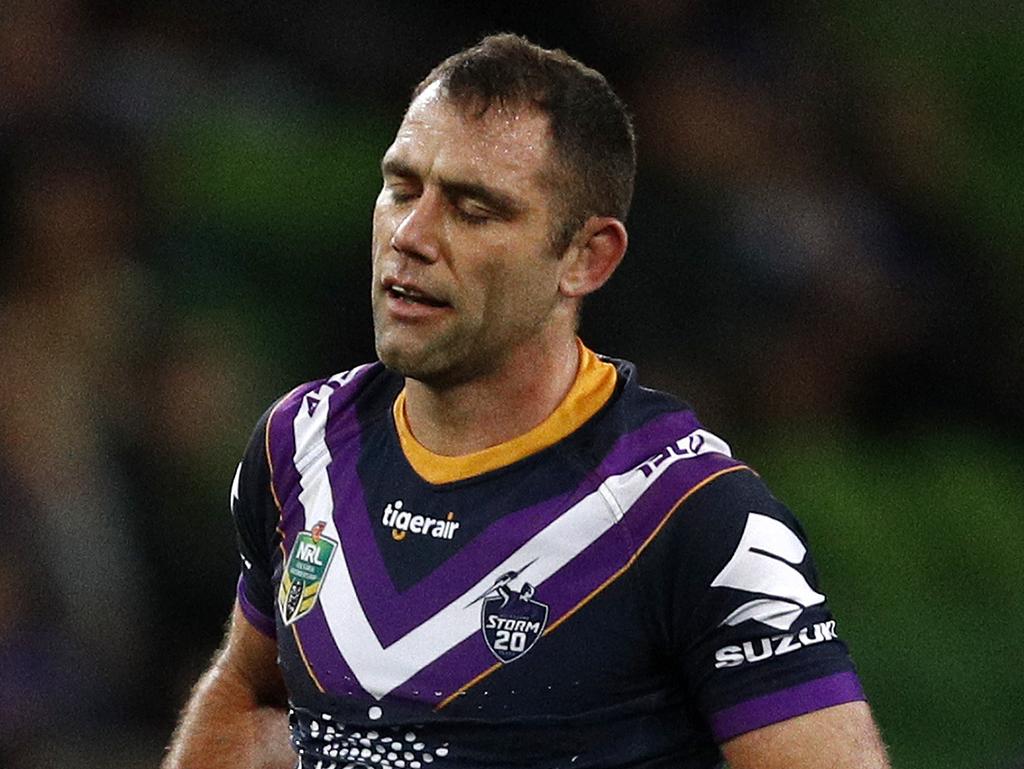 Cameron Smith of the Storm (right) receives medical attention during the Round 23 NRL match between the Melbourne Storm and the Parramatta Eels at AAMI Park in Melbourne, Friday, August 17, 2018. (AAP Image/Daniel Pockett) NO ARCHIVING, EDITORIAL USE ONLY