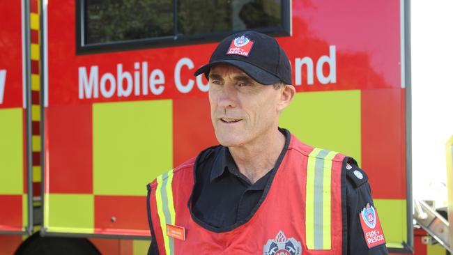 Fire and Rescue NSW Incident Commander Superintendent Greg Rankin. Crews and NSW Fire and Rescue have set up camp in Coramba, bringing with them vehicles and equipment to deal with the derailed train at nearby Nana Glen. The rain and subsequent flooding has so far meant they have been unable to access the site via road.  Train derailment.  Photo: Tim Jarrett