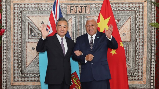 Fijian Prime Minister and Foreign Minister Frank Bainimarama (right) holds talks with Chinese State Councilor and Foreign Minister Wang Yi in Suva, Fiji, May 30, 2022. Picture: Getty Images