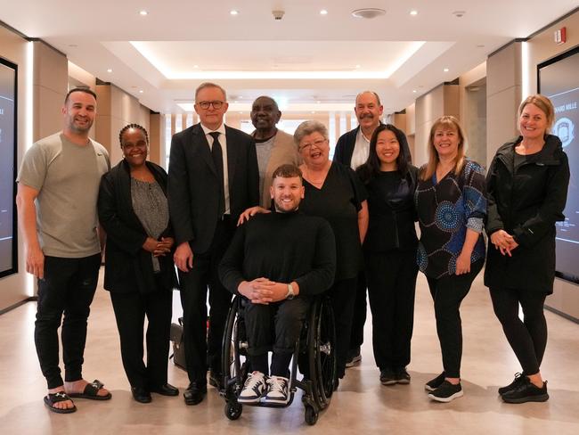 Australian delegation of mourners with Anthony Albanese during a stopover in Dubai (L-R) Danny Abdallah, Saba Abraham, Dr Miriam-Rose Ungunmerr Baumann, Dylan Alcott (front), Valmai Dempsey, Kim Smith APM, Trudy Lin, Professor Helen Milroy and Shanna Whan. Picture: Supplied