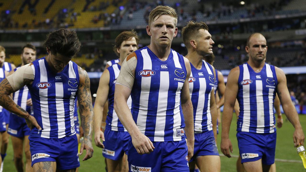 North captain Jack Ziebell leads his dejected club off Marvel Stadium after the loss to Brisbane. Picture: AAP