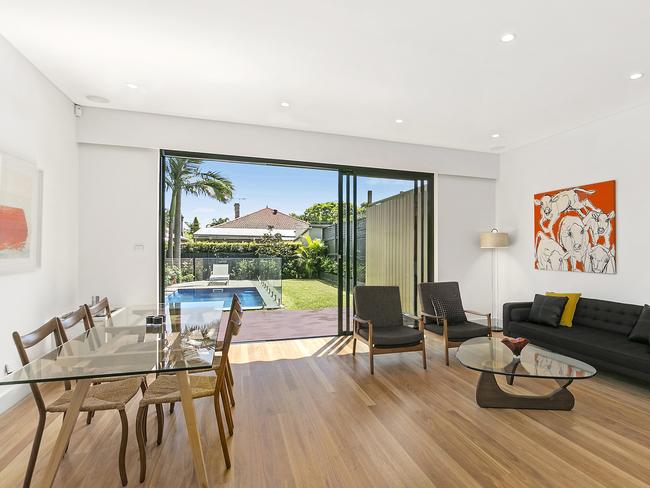 The lounge and dining room opens out to a backyard.