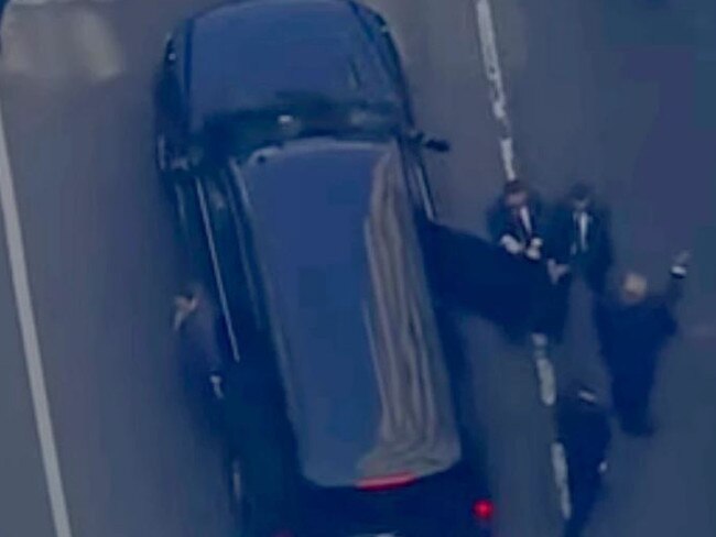 Donald Trump waves to supporters as he arrived at court in New York. Picture: Supplied