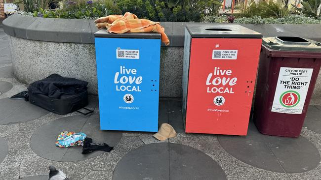 Used needles, clothing and other trash are strewn throughout Acland St daily