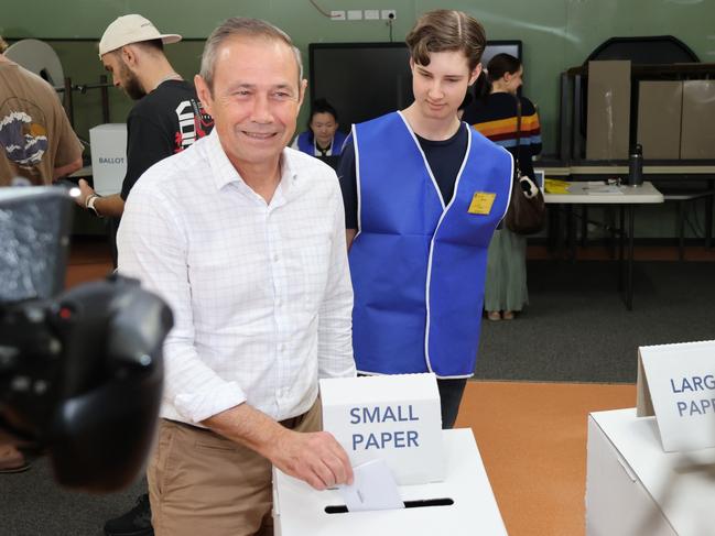 Roger Cook and his wife Carly Lane cast their votes at Calista Primary School, in Mr Cook's electorate of Kwinana, on Saturday morning. Picture: Paul Garvey / The Australian