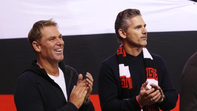 Eric Bana with another famous Saints supporter, Shane Warne, who died suddenly in March. Picture: Michael Klein