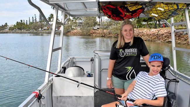 FISH BITING: Bamboo Projects founder Kristy Paterson on the new wheelchair accessible boat with Zane Cecil. Picture: Eden Boyd