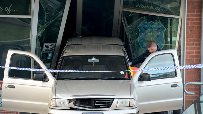A stolen vehicle wedged in the entrance of Norm Parker Pavillion at Baxter Park, Frankston South. Picture: Andrew Henshaw