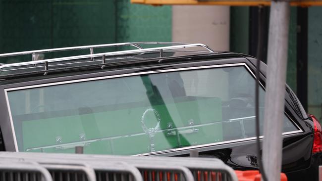 Brownie’s green casket arrives at the Mosque. Picture: David Swift