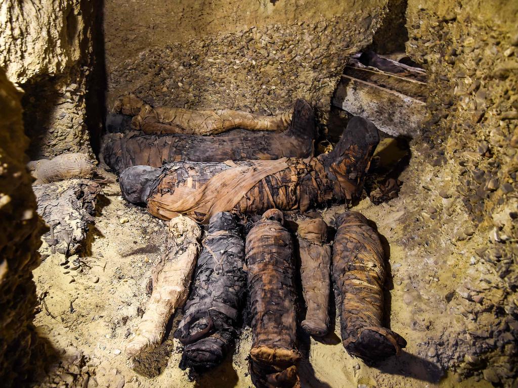 This picture taken on February 2, 2019 shows newly-discovered mummies wrapped in linen found in burial chambers dating to the Ptolemaic era (305-30 BC) at the necropolis of Tuna el-Gebel in Egypt's southern Minya province, about 340 kilometres south of the capital Cairo. Picture: Mohamed el-Shahed 
