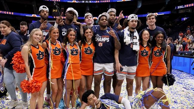 The Auburn Tigers celebrate after the SEC Tournament Championship. Photo by Andy Lyons/Getty Images.