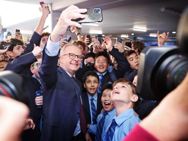 King of the kids. Anthony Albanese visits St Mary’s Cathedral School in Sydney on Monday. Picture: Sam Ruttyn