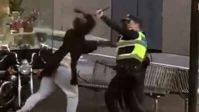 A man on Bourke St lunges at police with knife before he was shot.