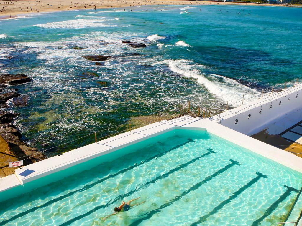 A lone swimmer has a dip in the small pool at Icebergs while the big pool gets a coat of paint. Picture: Chris Pavlich