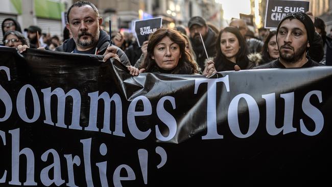 Supporters ... Turkish journalists hold a banner which read: 