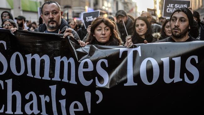 Supporters ... Turkish journalists hold a banner which read: "We all are Charlie" as they march on Istiklal avenue to French consulate, in Istanbul during a rally they organised after the Paris attacks. Picture: AFP