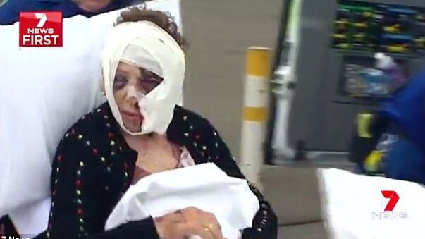 Anita Christanga is treated for horrific injuries at Seven Hills shopping centre hours after she was attacked in her Toongabbie home. Picture: Seven News