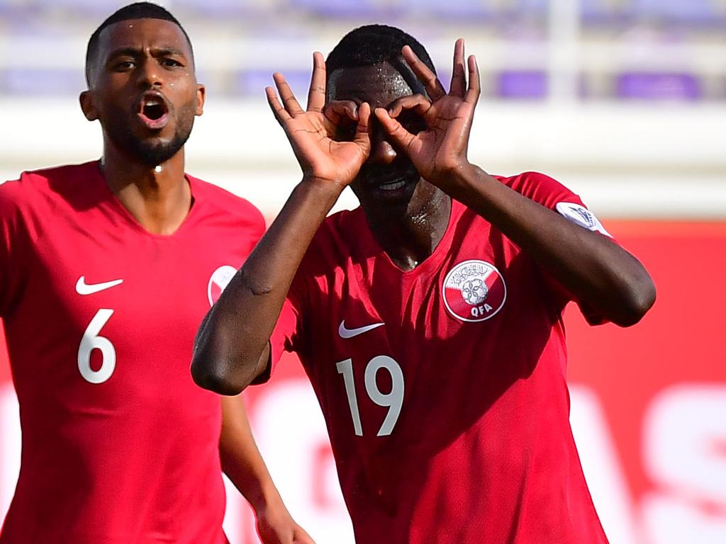 Qatar's forward Almoez Ali (1st-R) during the 2019 AFC Asian Cup group E football match between North Korea and Qatar at the Khalifa bin Zayed stadium in al-Ain on January 13, 2018. (Photo by Giuseppe CACACE / AFP)