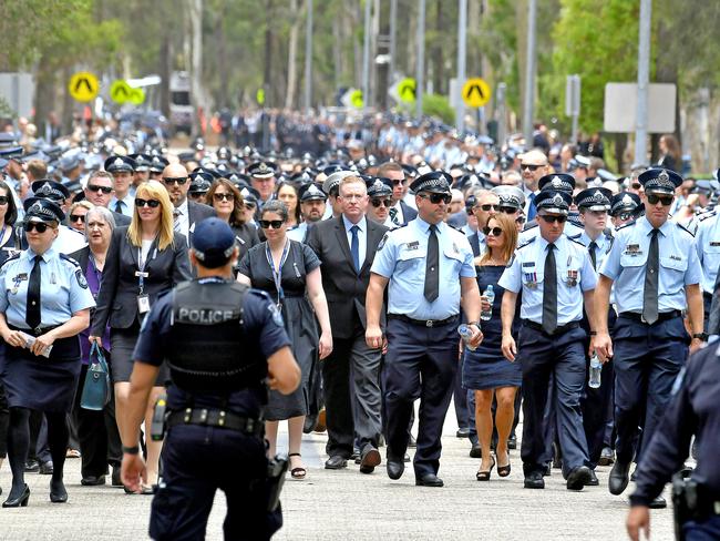 Mourners at the memorial service with full police honours for constables Rachel McCrow and Matthew Arnold at Brisbane Entertainment Centre. Picture: John Gass/NCA NewsWire