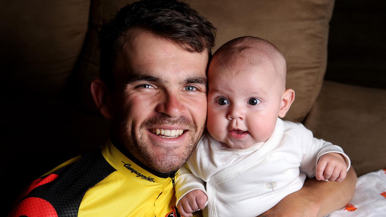 CYCLING - Jack Bobridge at home with baby daughter Amellie before competing in the Tour Down Under. Photo Sarah Reed.