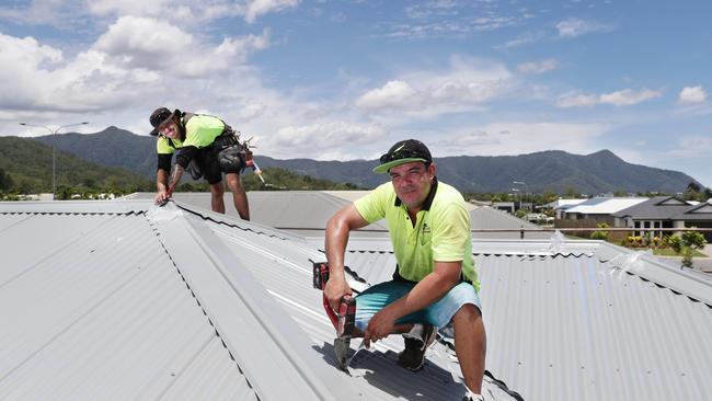 Roofer Josh Vidich and leading hand supervisor Daryl Hall work on a newly constructed home in the Mt Peter residential estate just south of Edmonton. Picture: Brendan Radke