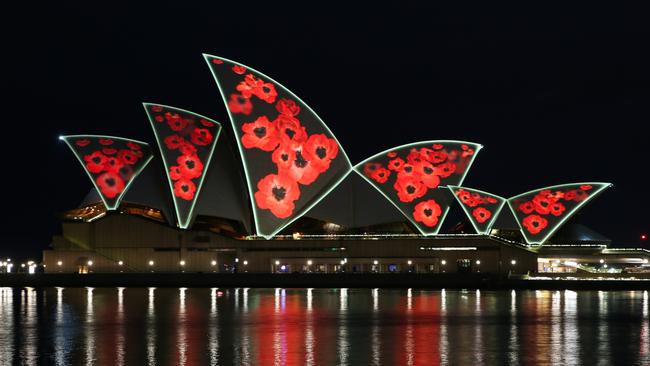 Sydney Opera House lights up for Remembrance day dawn service with poppies projected on the shells of the Sydney Opera House with The Minister for Veterans, David Harris, and the RSL NSW President, Mick Bainbridge. Picture: NewsWire / Gaye Gerard