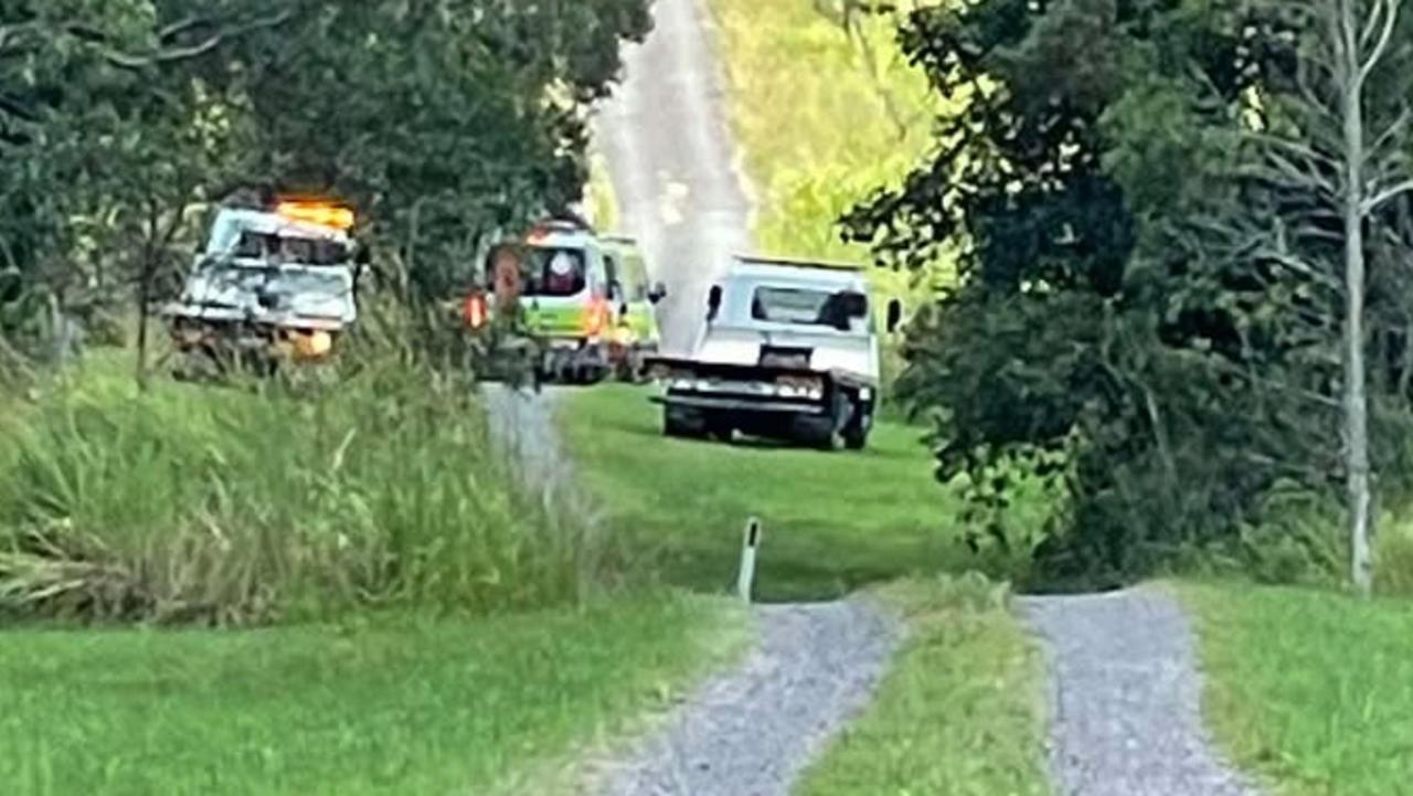 Paramedics work on man trapped in Traveston rollover