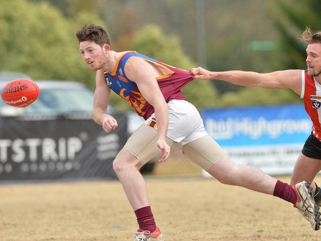 Nepean Football League: Devon Meadows v Tyabb at Glover Reserve, Devon Meadows. Tyabb #32 Liam Rogan under pressure from Devon Meadows #32 Locky Burke.  Picture: AAP/ Chris Eastman