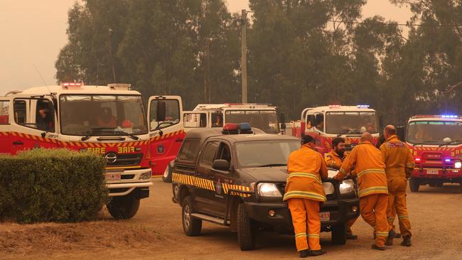 Firefighters opposite the Kermandie Hotel in Port Huon today. Picture: NIKKI DAVIS-JONES