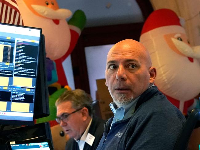 Traders and financial professionals work on the floor of the New York Stock Exchange (NYSE) at the opening bell on November 26, 2024, in New York City. (Photo by TIMOTHY A. CLARY / AFP)