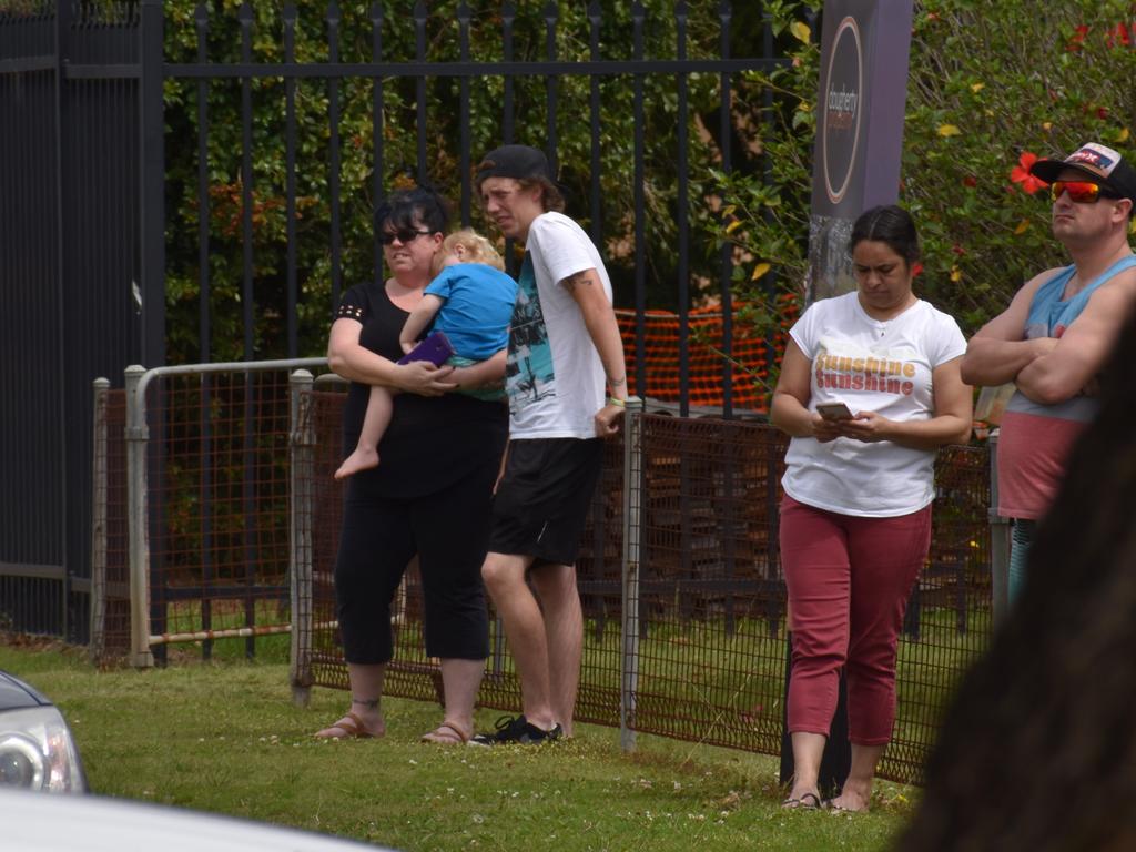 Residents watch on as police attempt to diffuse a situation involving a man at a Turf St property in Grafton on Sunday, 20th September, 2020.