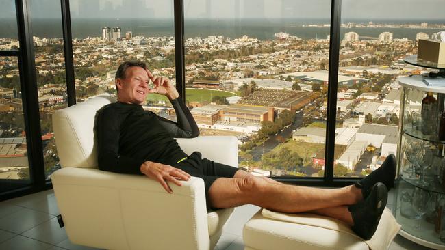 Newman at his Docklands home, a far cry from his place at the back of an Ascot Vale shop. Picture: Colleen Petch