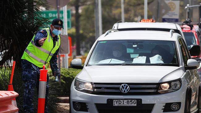 Border bubble opens to Northern NSW essential service workers. Police at the Queensland border on Griffith Street Coolangatta. Picture: NIGEL HALLETT