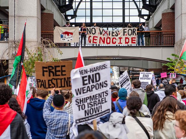 Pro-Palestinian demonstrators gather at Faneuil Hall Marketplace during a "No Votes for Genocide" rally organized by the Boston Coalition for Palestine ahead of the US general election in Boston on November 2, 2024. (Photo by Joseph Prezioso / AFP)